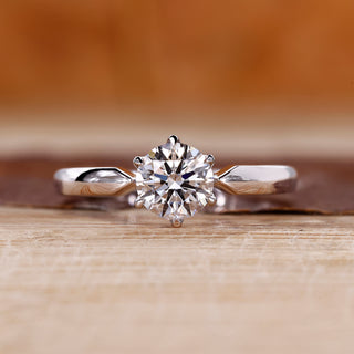 Round cut diamond ring solitaire pinched shank style.

