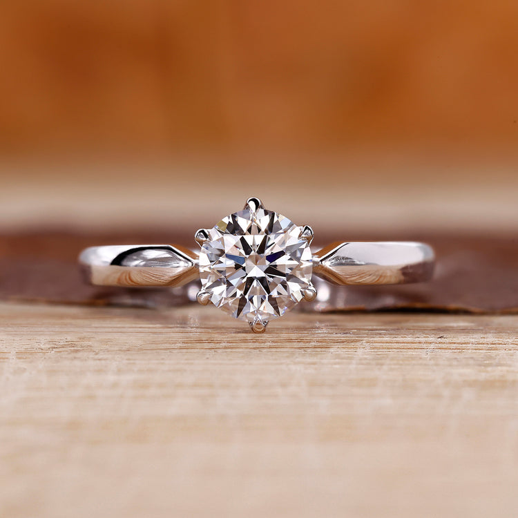 Round cut diamond ring solitaire pinched shank style.
