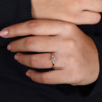 Round cut ring elegant three stone setting.