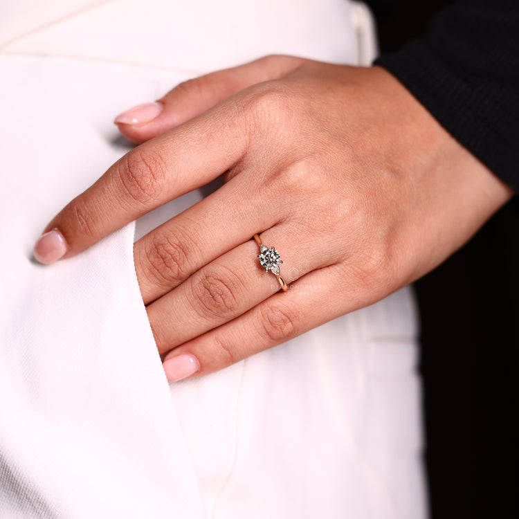 Lab grown round diamond three stone ring style.