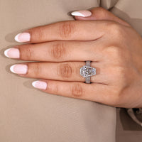 Coffin cut diamond ring round diamond pave halo.
