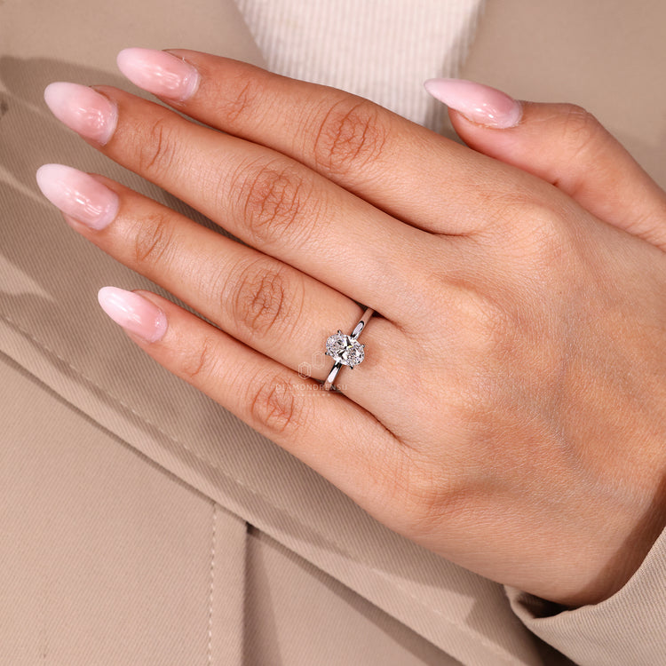 Handmade oval diamond ring hidden halo setting.