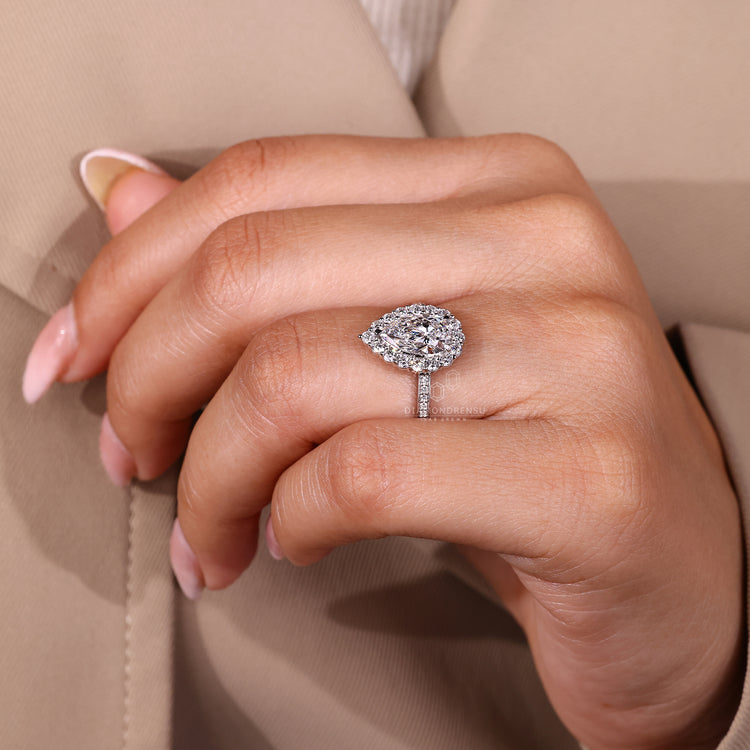 Pear cut diamond ring IGI certified halo style.

