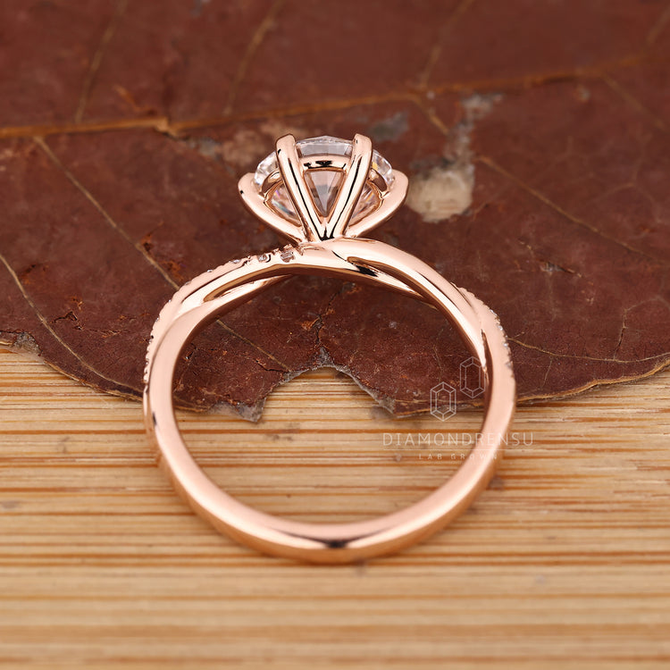 Round diamond ring twisted pave six claw setting.