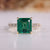 Asscher cut emerald gemstone ring pave four claw prong.

