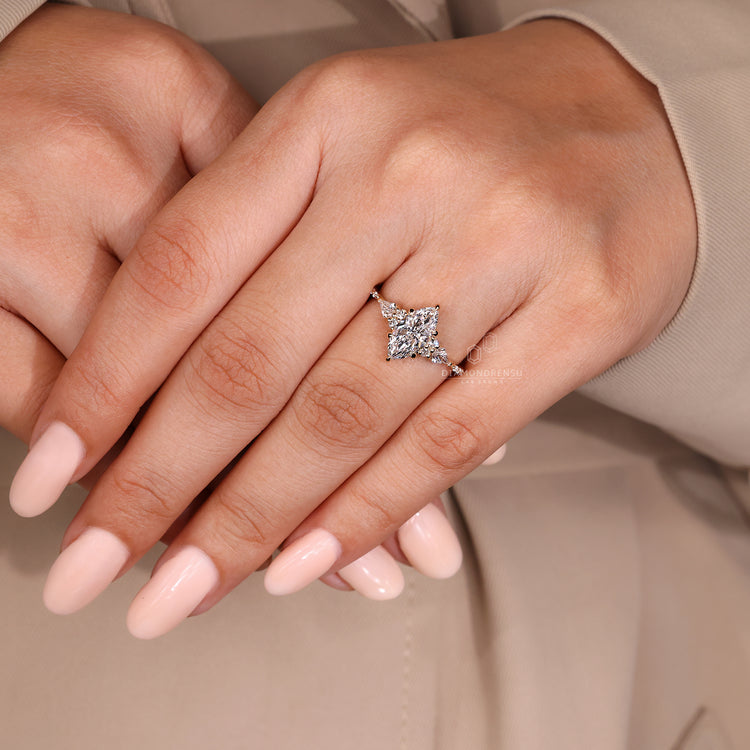 Tapered shank marquise diamond engagement ring style.
