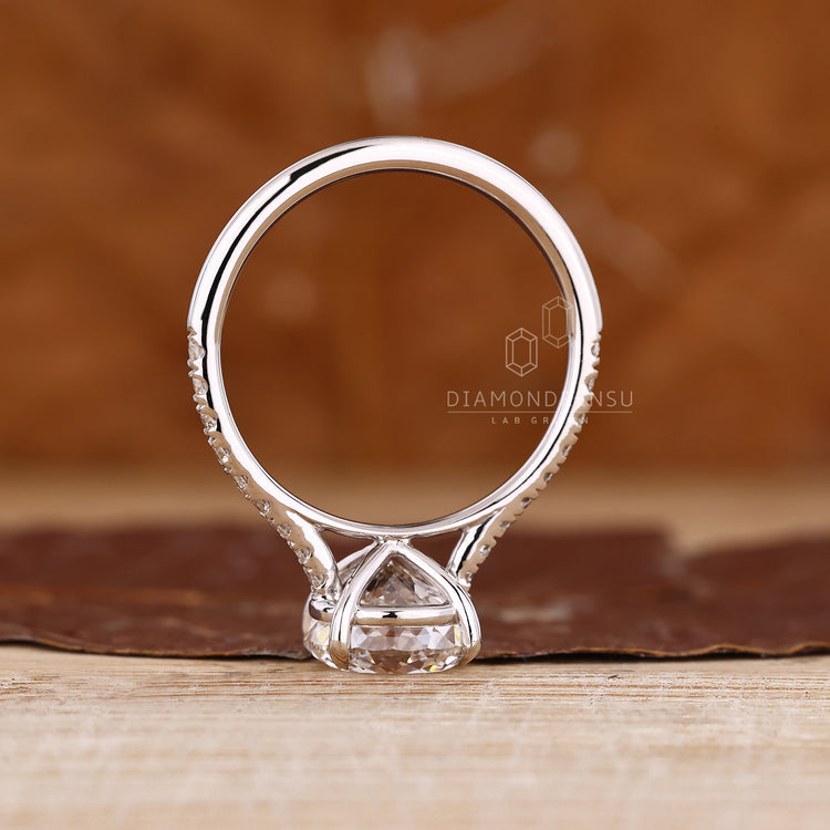 IGI certified Portuguese cut ring four claw setting.
