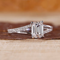 Pave emerald diamond ring split shank four claw prong.

