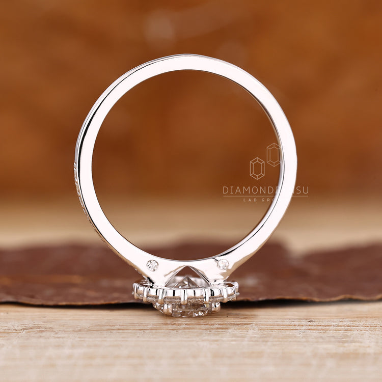 Pear diamond ring halo pave round diamond set.
