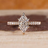 Dutch marquise diamond ring with round diamond pave style.
