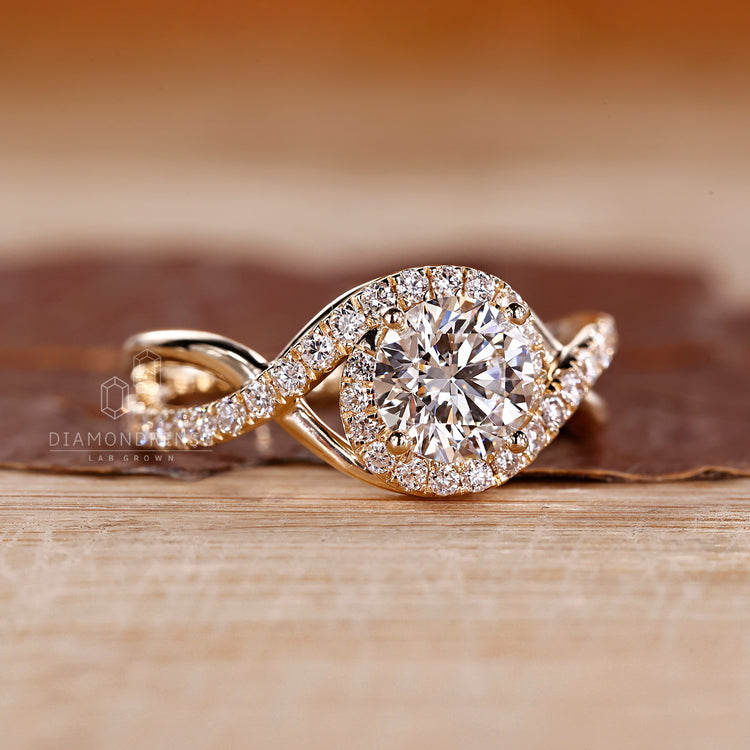 Halo round diamond ring twisted shank four prong.
