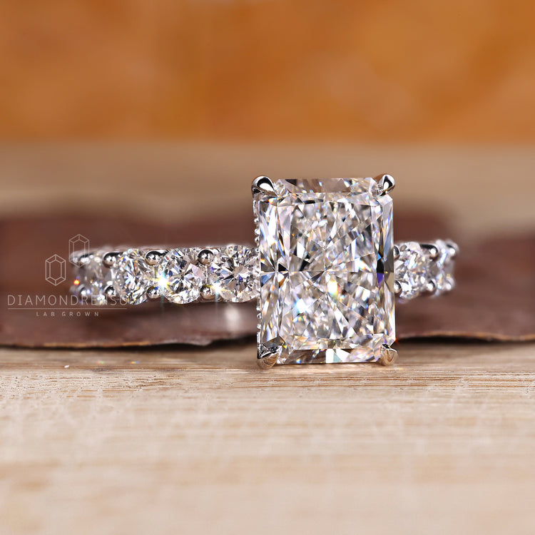 Handmade radiant cut ring with u prong pave setting.
