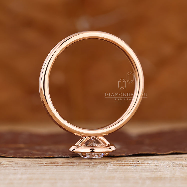 Round diamond ring halo bezel prong set design.
