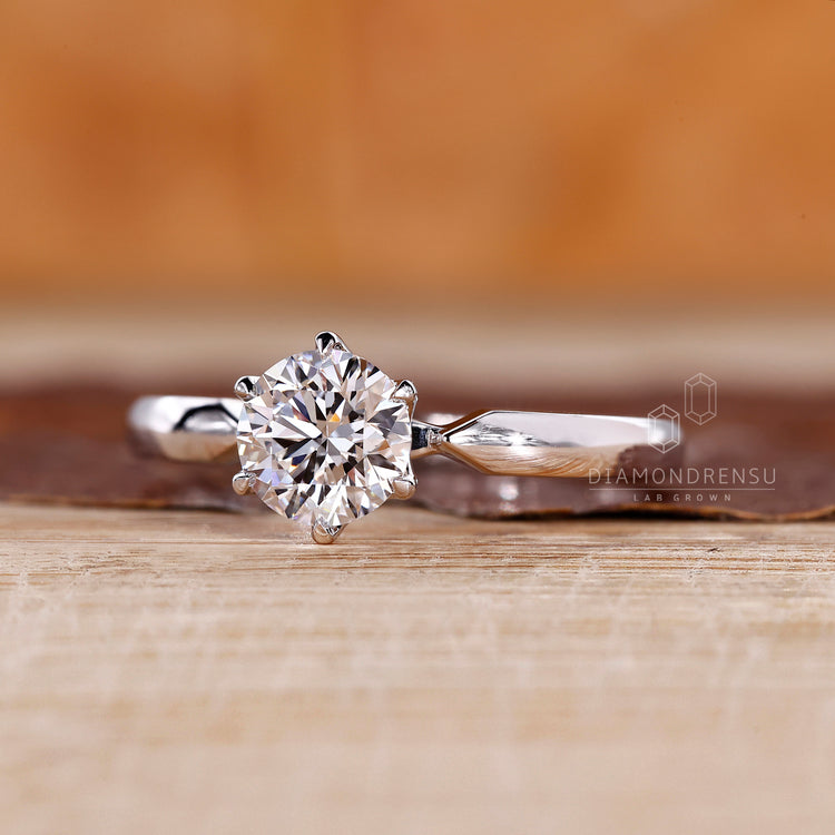 Lab grown round diamond ring pinched shank style.
