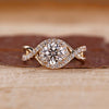 Round cut diamond ring halo twisted shank four prong.
