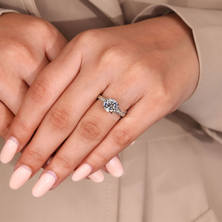 Round cut diamond ring IGI certified milgrain bridge.
