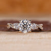 Round cut diamond ring three stone twisted shank vintage.