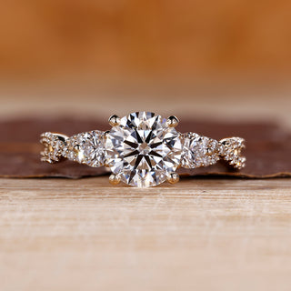 Round cut diamond ring three stone twisted shank vintage.
