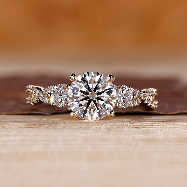 Round cut diamond ring three stone twisted shank vintage.