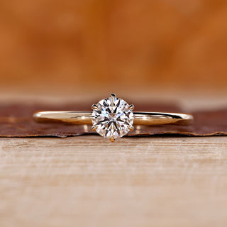 Round cut diamond ring solitaire six claw prong set.
