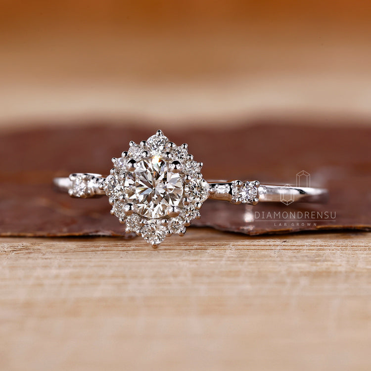 Lab grown round diamond ring halo cluster style.
