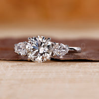 Lab grown round diamond ring three stone style.
