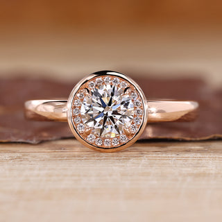 Round diamond ring halo bezel four claw prong setting.
