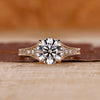Round cut diamond ring tapered pave milgrain bridge set.
