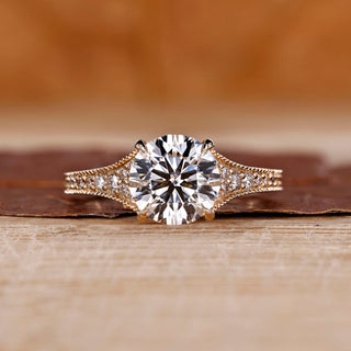 Round cut diamond ring tapered pave milgrain bridge set.
