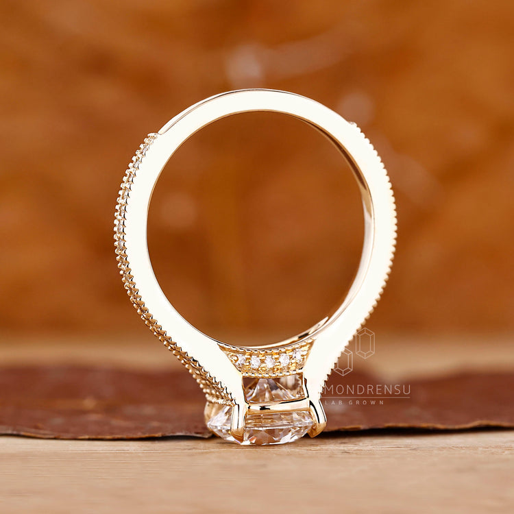 Round diamond ring milgrain bridge accent prong set.
