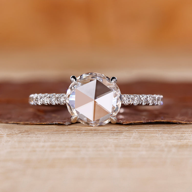 Round rose cut diamond ring with round diamond pave setting.
