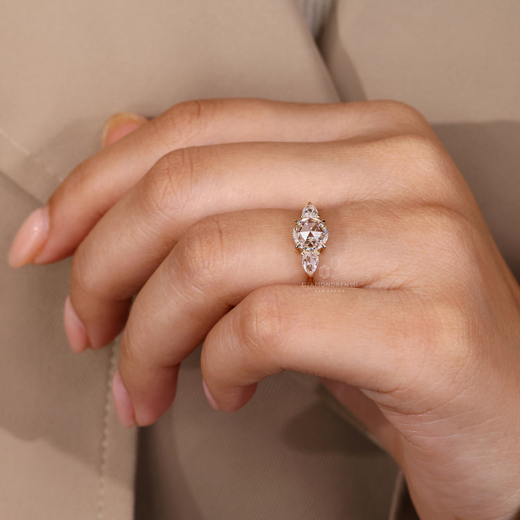 Lab grown diamond ring with rose cut pear side stones.
