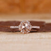 Round rose cut ring with round diamond halo and pave style.
