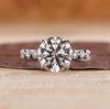 Three stone ring with blue oval center diamond.
