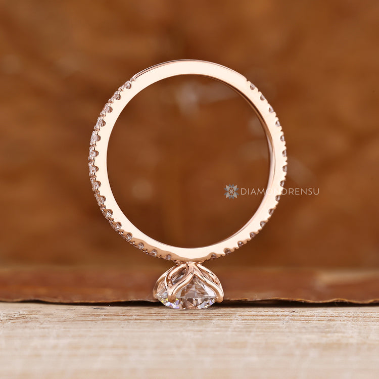 Handmade round diamond ring with tulip basket setting.