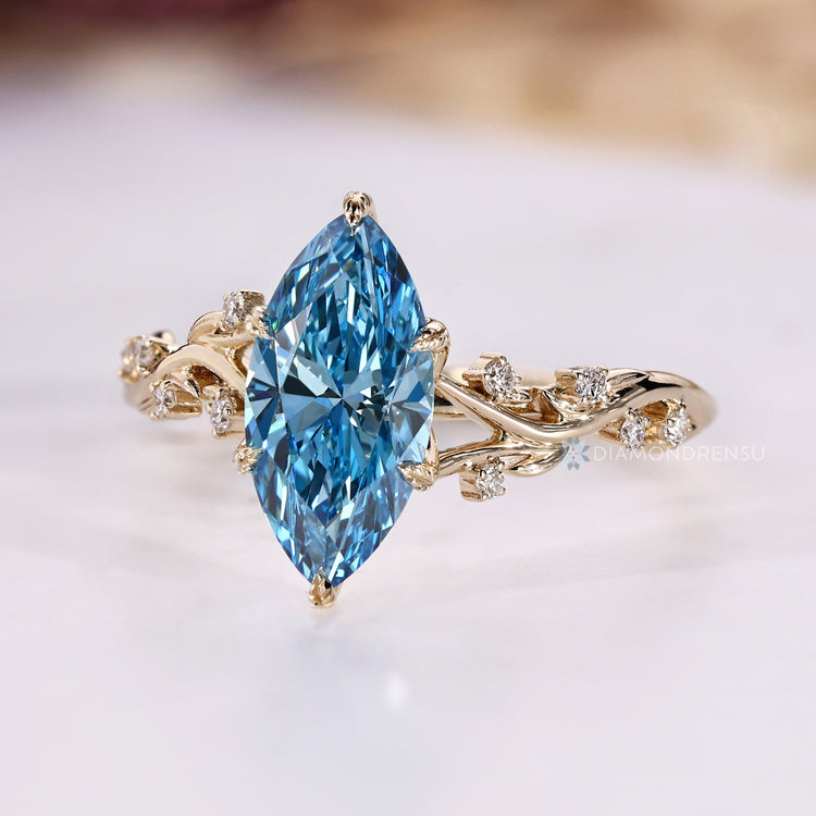 Marquise diamond ring with leaf style prong setting.