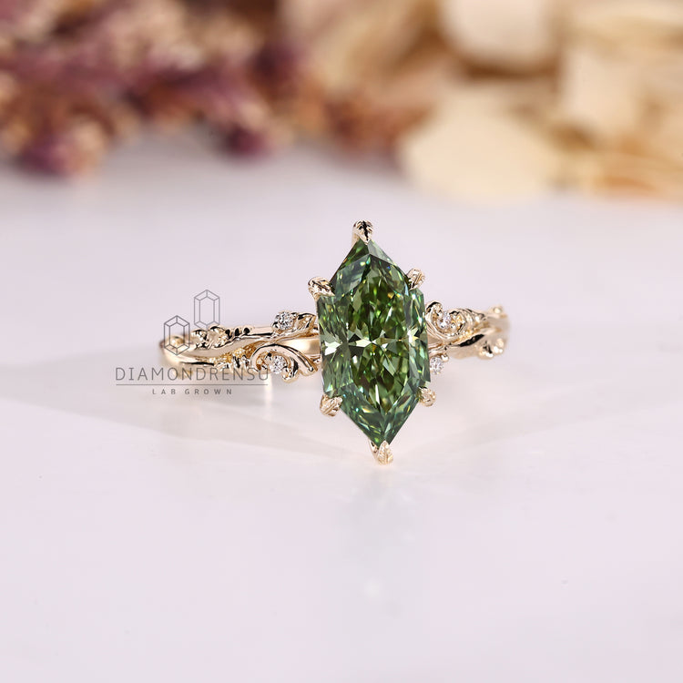 Leaf prong marquise diamond ring with round side stones.