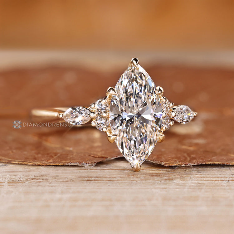 Marquise diamond ring with tapered shank.