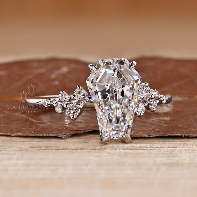 Cluster coffin diamond ring side stones style.