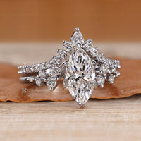 Marquise ring with round diamond side stones.