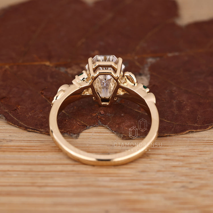 IGI certified coffin diamond ring emerald stones.