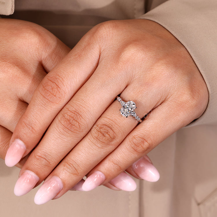 Oval diamond ring IGI certified cathedral setting.
