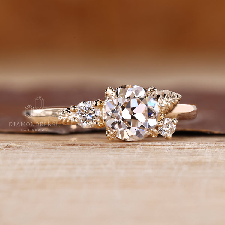 Handmade Round Old European Cut Ring with leaf prongs.

