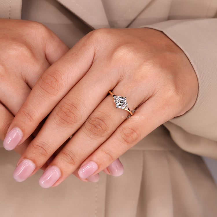 Handmade hexagon step cut diamond ring prong set.
