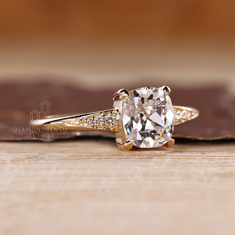Lab Grown Cushion Old European Cut Ring with four claw prongs.
