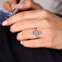 Marquise diamond ring with kite cut side stones.