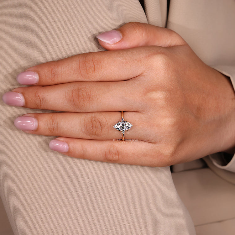 Marquise cut ring cathedral tapered shank prong set.
