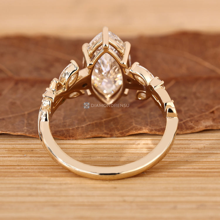 Handmade marquise diamond ring with six claw prongs.
