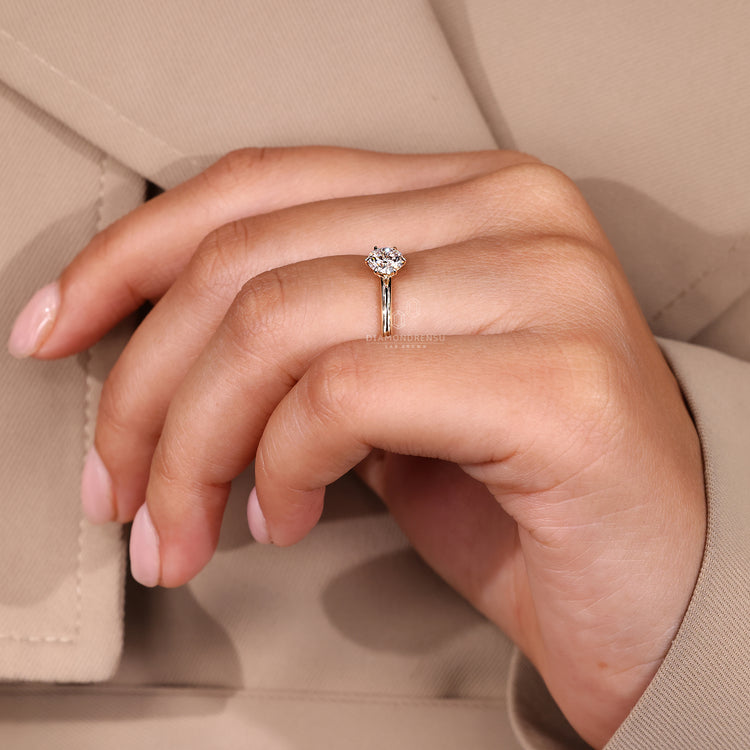 Round cut ring solitaire prong setting style.
