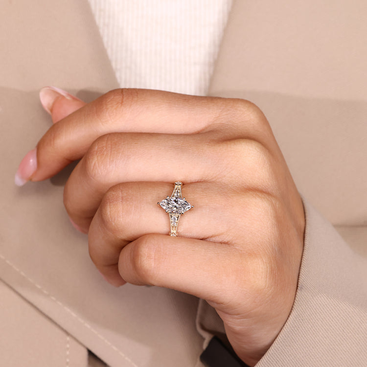 Marquise diamond ring cathedral prong setting.